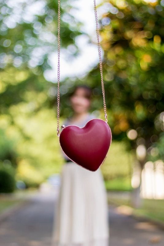 personal care and Love - selective focus photography of heart pendant chain link necklace